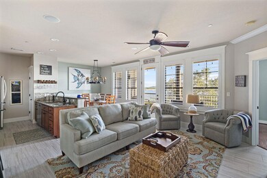 Living area featuring a chandelier, light wood-st