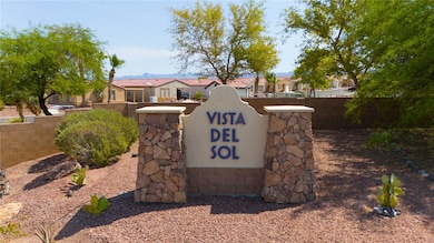 Community / neighborhood sign featuring a residential view