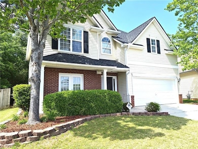 Traditional-style home featuring fence, a front ya