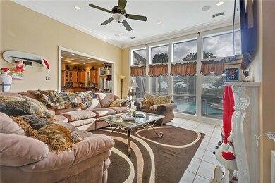 Comfortable living room overlooking the pool and l