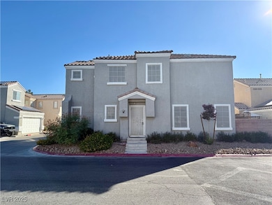 Mediterranean / spanish house with a tiled roof and stucco siding