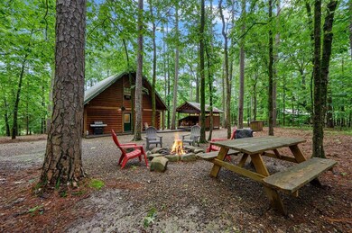 View of backyard with a fire pit