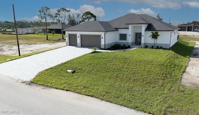 View of front of property featuring a garage, deco