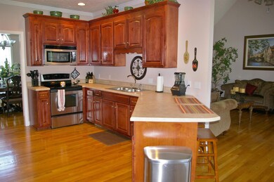 Kitchen with Cherry cabinets and hardwood floors
