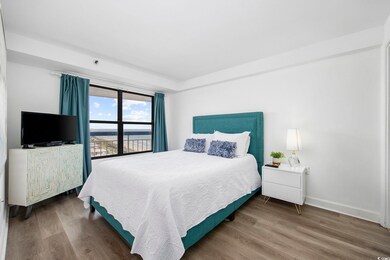 Bedroom with dark wood-type flooring