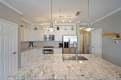 Kitchen featuring a spacious island, visible vents