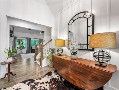 Office space with wood finished floors and high vaulted ceiling