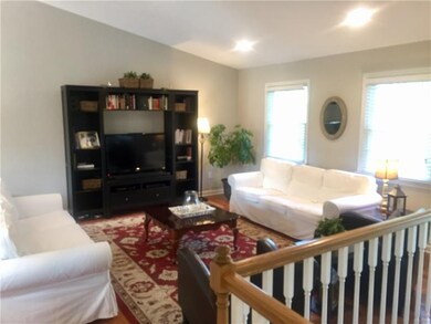 Tasteful living room with hardwood floors and Cath