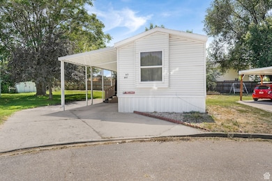 View of front of home featuring a shed