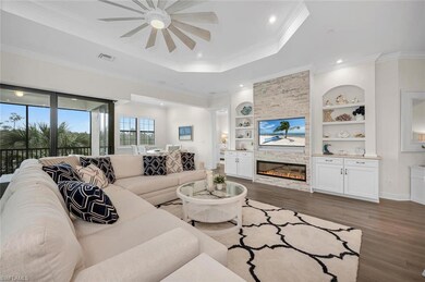 Living room with visible vents, ornamental molding