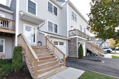 stairs to front door, integral garage on right