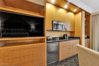 Kitchen with stainless steel microwave, dark count