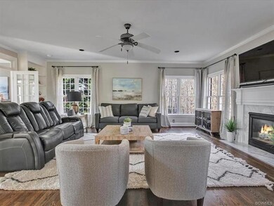Family room with refinished hardwood flooring and 