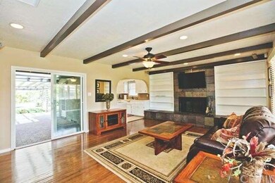 Living room with newer slider out to rear courtyar