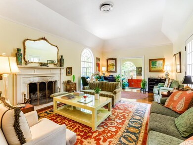 Living area featuring wood finished floors, a fir