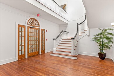 Elegant staircase leading to 3rd floor. Skylights