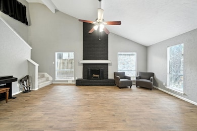Large living room with soaring ceilings and lots of natural light