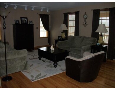 Living Room. LARGE ROOM WITH HARDWOOD  FLOORING.