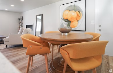Dining room featuring light wood-style flooring and recessed lighting
