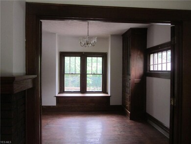 In living room looking into dining room, lots of o