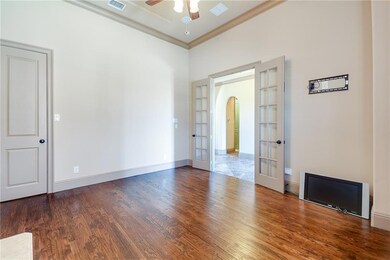 French doors connect the study to the foyer, and a