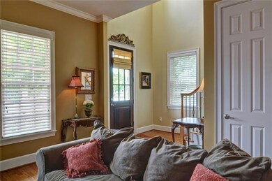 Impressive two-story foyer with niched area for artwork.  This END UNIT allows lots of windows and light.  It features GORGEOUS MILLWORK and 3