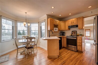 Eat-in kitchen with lots of windows and natural li