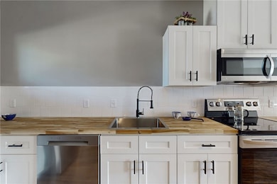 Kitchen featuring appliances with stainless steel
