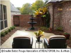 Relax in this Lovely Side Courtyard with Fountain.