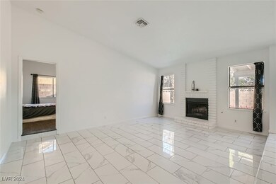 Living Room with Fireplace & entrance to Primary B