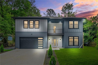 View of front facade featuring fence, a balcony, c