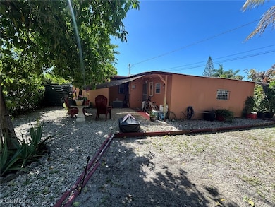 Rear view of house featuring stucco siding and a p