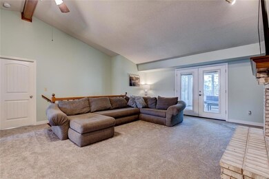 Great room w/ double doors to the sunroom