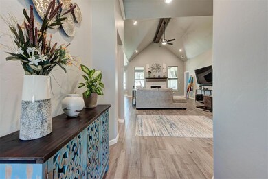Hall with wood finished floors, baseboards, and recessed lighting