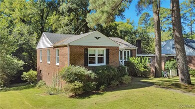 View of property exterior with a yard