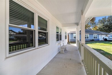 Fronch port that spans the length of the home.