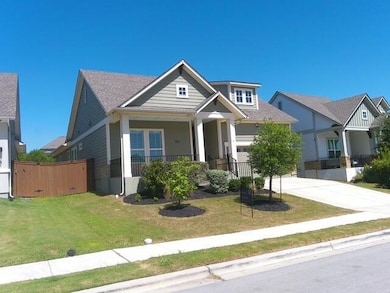 Craftsman-style house featuring concrete driveway, a porch, and an attached garage