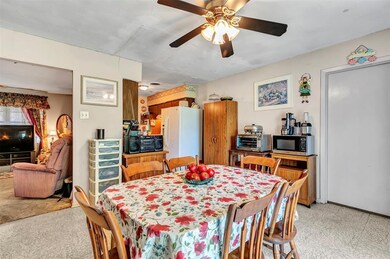 Open kitchen, dining area overlooks patio and larg