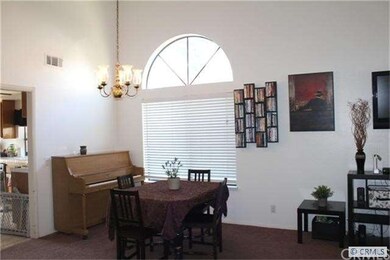 FORMAL DINING AREA WITH BEAUTIFUL LARGE WINDOW AND