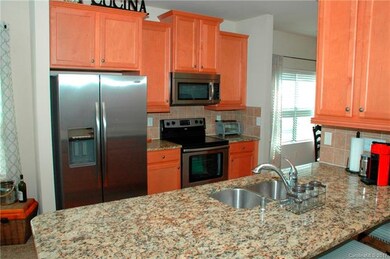 Beautiful kitchen with granite counter-tops, tile 
