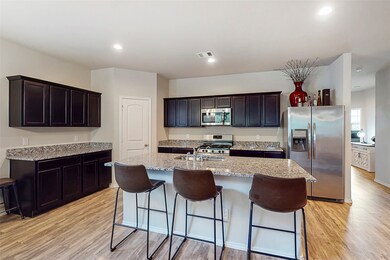 Spacious and very functional kitchen. Walk in pantry is tucked in the corner.