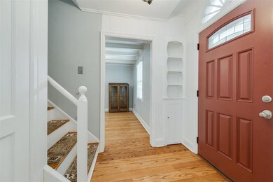 Entrance foyer featuring beam ceiling, ornamental 