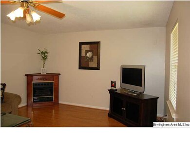 The great room/living area has a corner gas firepl