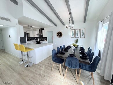 Dining space featuring a chandelier and light wood-style flooring