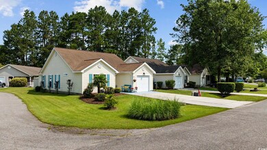 Ranch-style house with concrete driveway, a front yard, an attached garage, and a shingled roof