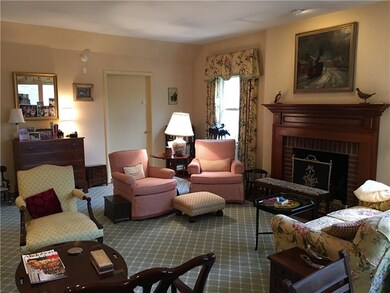Large living room with woodburning fireplace and g