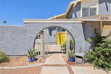 Entrance to property with stucco siding