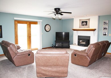 Open living room with wood fireplace, built in des