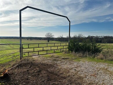 View of yard featuring a rural view and fence