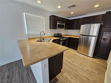 Kitchen featuring appliances with stainless steel